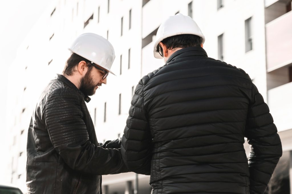 engineers-discussing-plans-street