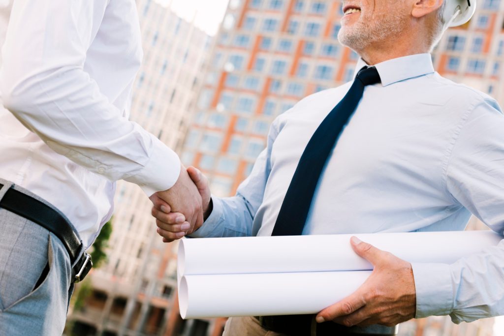 low-angle-men-shaking-hands